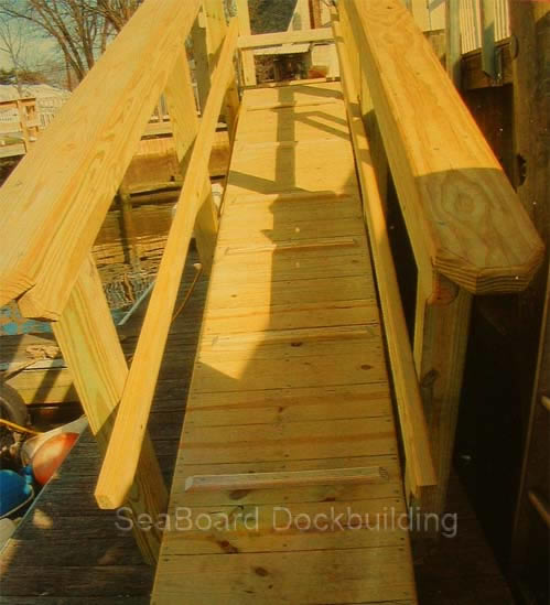 a wooden gang plank style ramp with safety tread